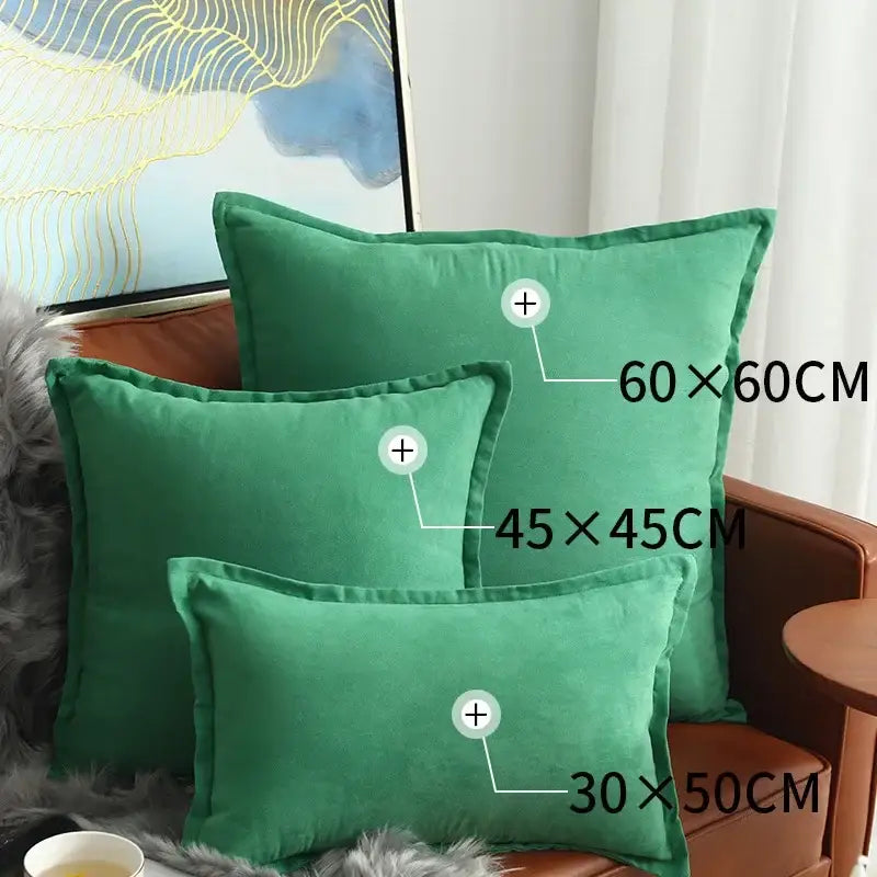 Three emerald green velvet throw pillows on brown leather couch complement plush black and white houndstooth cushion cover decorbites houndstooth cushion
