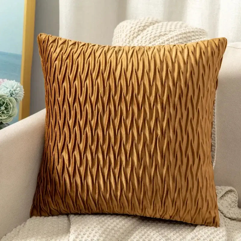 A square mustard-yellow cushion cover with textured pleated fabric contrasting decorbites houndstooth cushion cover