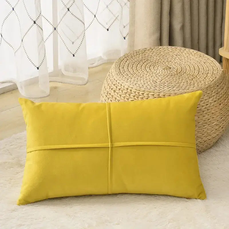 A vibrant yellow rectangular cushion with plush fabric and stitched sections as a decorbites houndstooth cushion cover