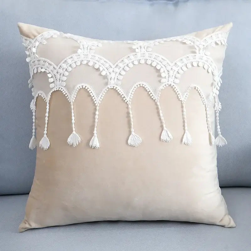 Beige velvet pillow with white lace trim and tassels complementing plush black and white decorbites houndstooth cushion cover