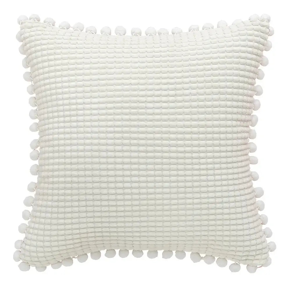 White textured cushion cover with waffle weave and pom-poms complements decorbites houndstooth cushion cover design