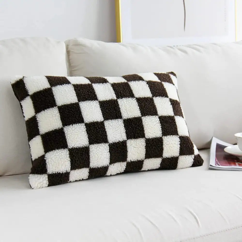 A cozy plush black and white houndstooth cushion cover with a fuzzy texture for bedroom decorbites pillow