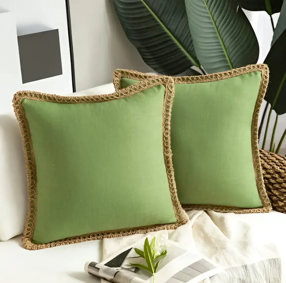 Two sage green linen throw pillows with woven jute trim complement plush black and white decorbites houndstooth cushion cover