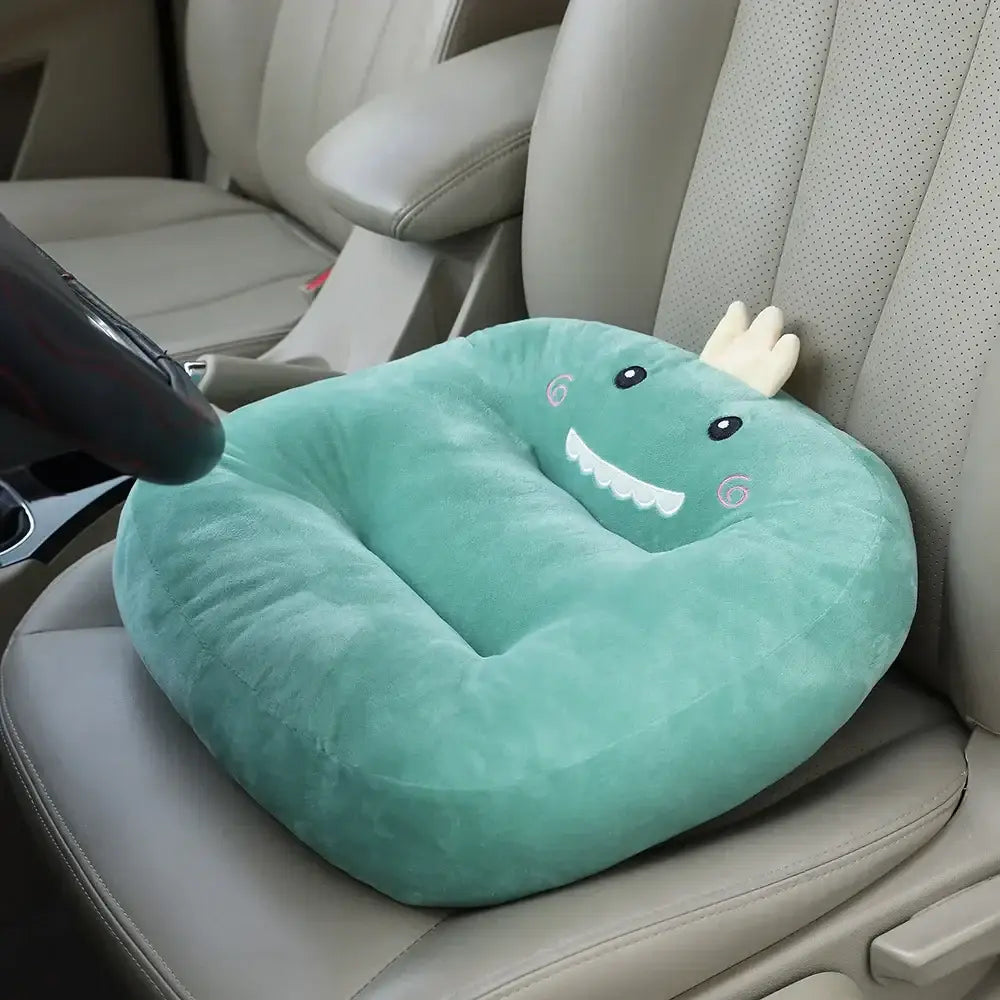A soft mint-green plush dinosaur cartoon car cushion with embroidered eyes and horns for decorbites cartoon car use