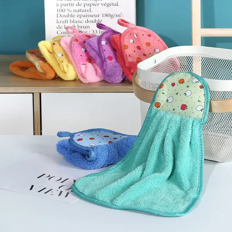 Turquoise microfiber hand towel paired with a fruit-patterned fabric headband featuring decorbites coral velvet hand design