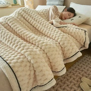 Cream-colored plush flannel fleece blanket with chunky knit texture and black trim perfect for cozy flannel fleece decorbites
