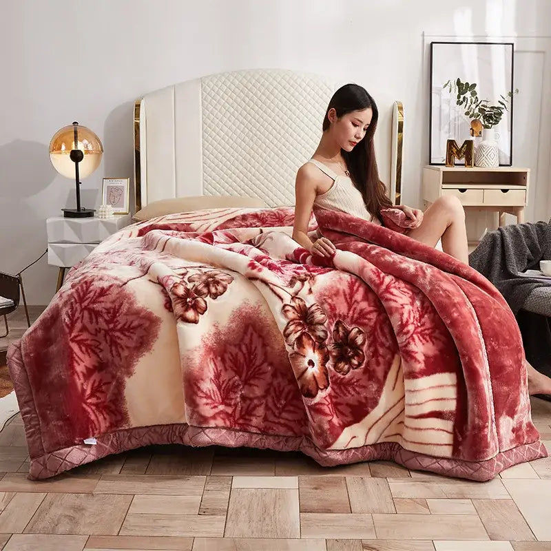Plush red and cream floral-patterned double layer raschel throw blanket with soft velvety texture for bedroom use