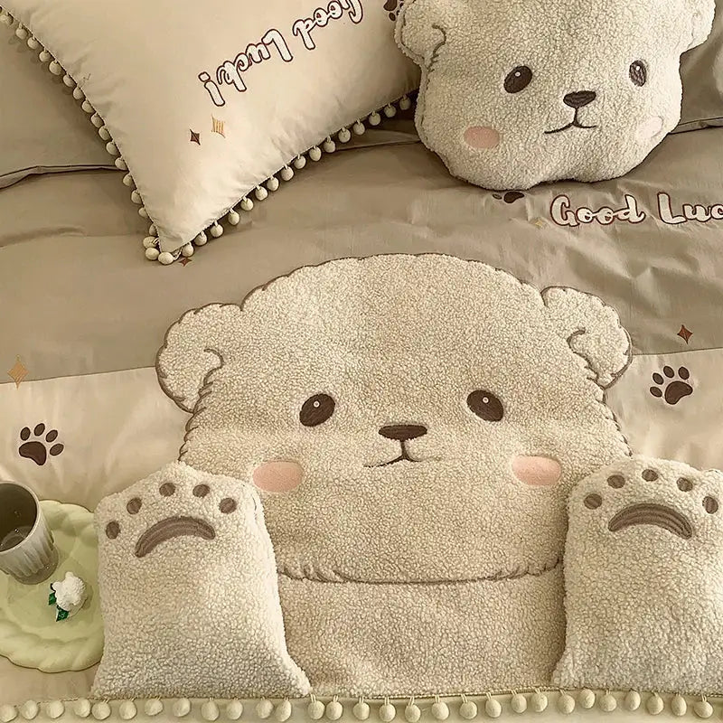 Cream-colored plush bear applique cotton bedding set with embroidered facial features and pom-pom trim quilt cover