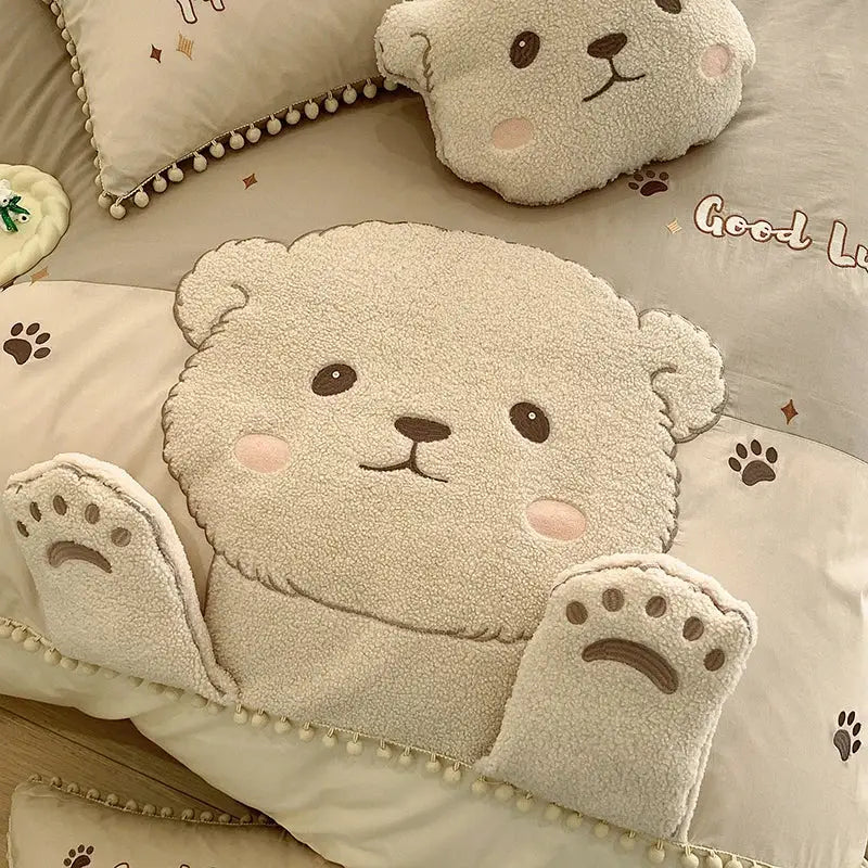 Cream cotton bedding set featuring a plush cream cartoon bear applique with embroidered face and paw feet details