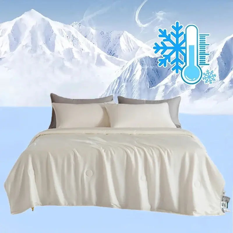 Cream-colored plush quilted decorbites cooling comforter with silky soft satin-like finish for bedroom use
