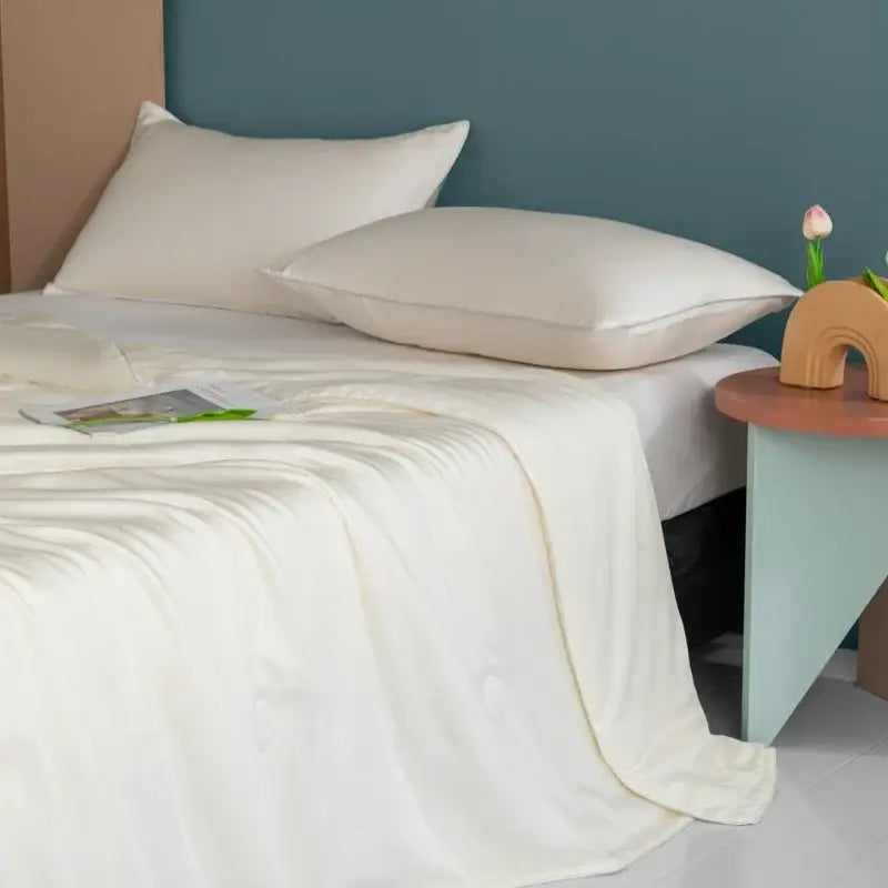 Plush cream cooling comforter made of silky soft satin sheet with smooth glossy finish for decorbites cooling comforter