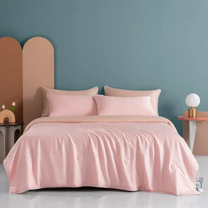 Soft pink satin duvet cover with subtle quilted detailing on plush cream decorbites cooling comforter for bedroom