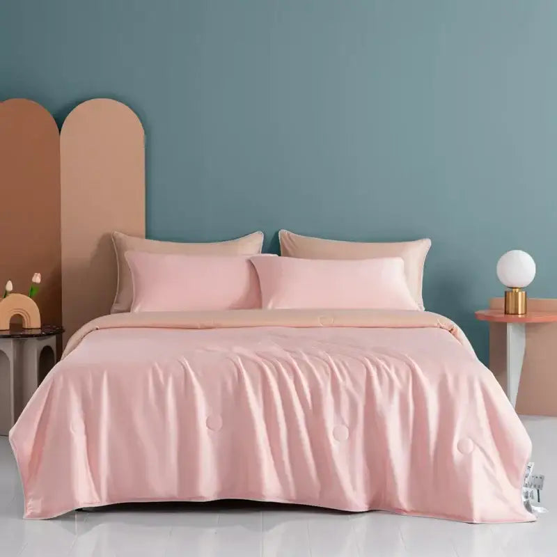 Soft pink satin duvet cover with subtle quilted detailing on plush cream decorbites cooling comforter for bedroom