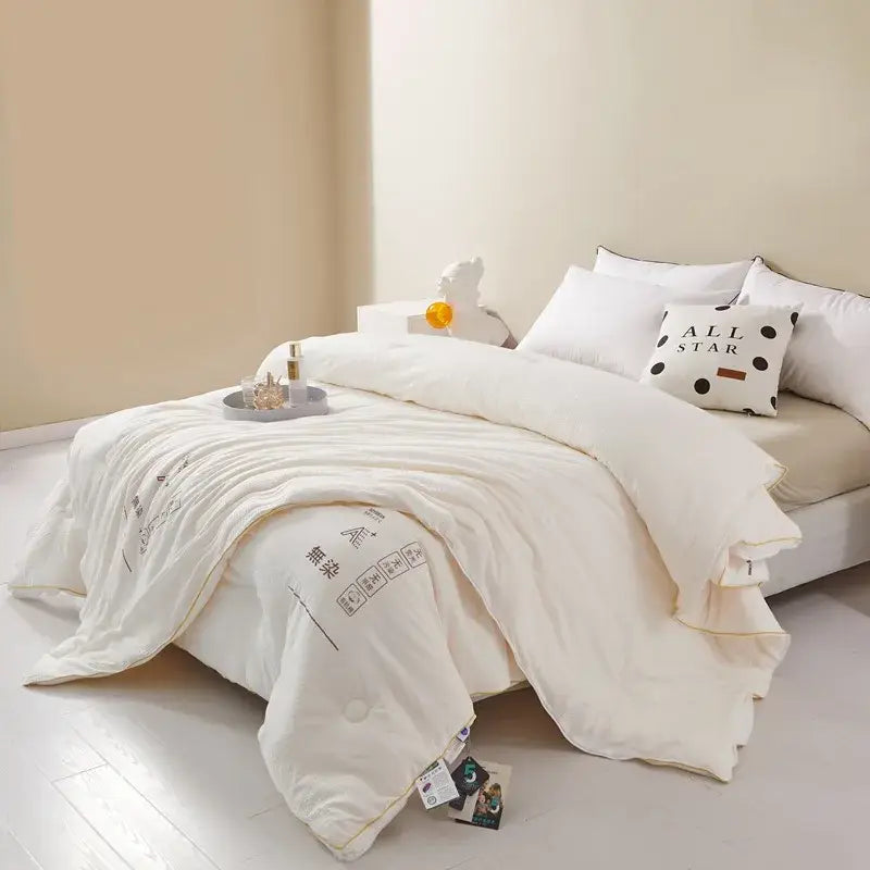 Plush cream cozy soy fiber quilt with subtle black text and soft texture ideal for bedroom bedding decorbites cozy soy
