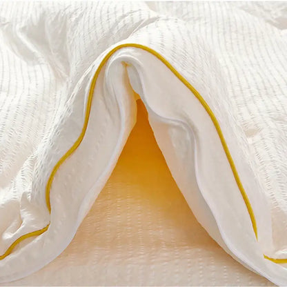 Plush cream cozy soy fiber quilt with white texture and yellow piping for bedroom bedding by decorbites cozy soy