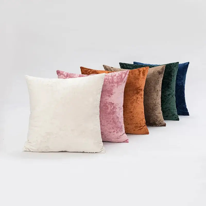 A collection of plush dark grain velvet pillow covers in cream blush pink terracotta taupe deep green and navy blue tones