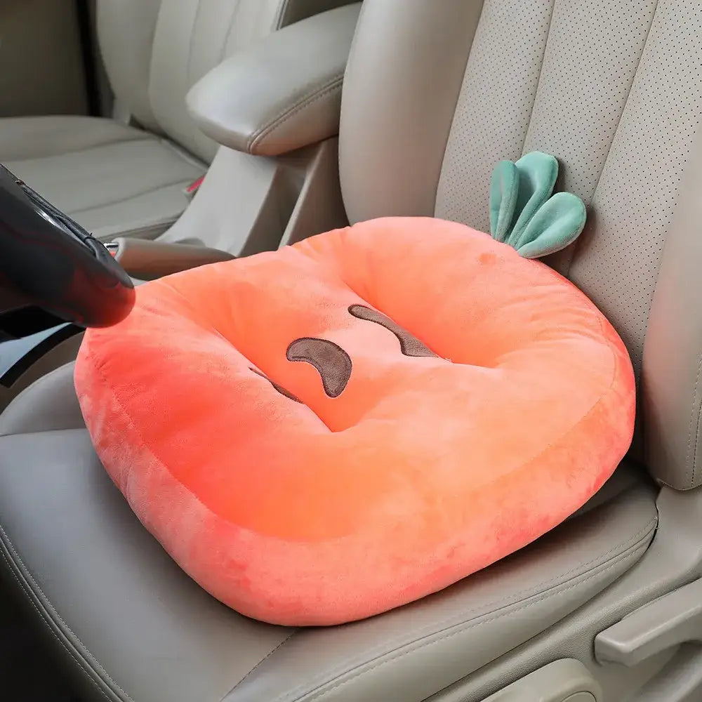 A plush peach carrot-shaped car seat cushion with green top and embroidered face for kids room cat shark cushion