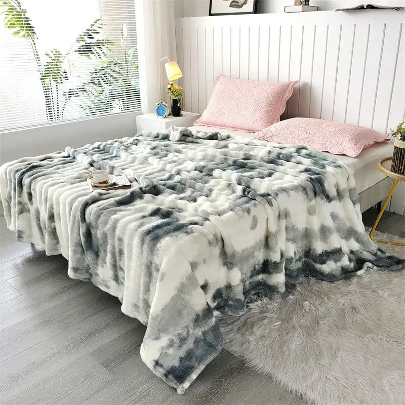 Plush soft gray and white tie-dye fleece throw blanket with chunky weave for living room use