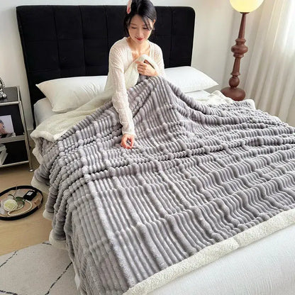 A plush gray and white ribbed sherpa blanket with cozy lamb wool and decorbites cozy lamb soft fleece border