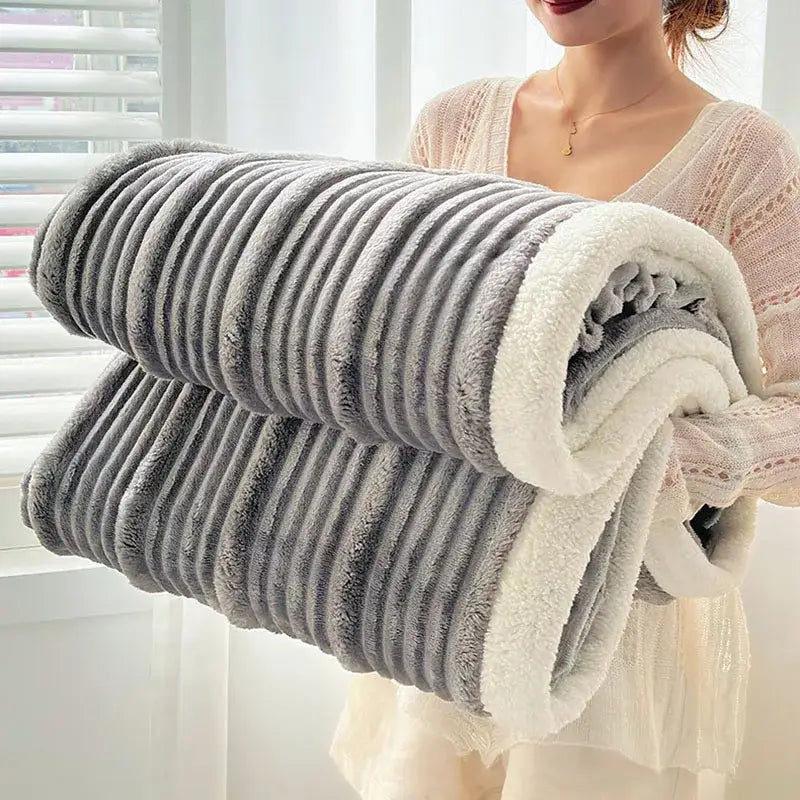 A plush gray and white ribbed sherpa blanket with cozy lamb wool lining for warm decorbites cozy lamb comfort