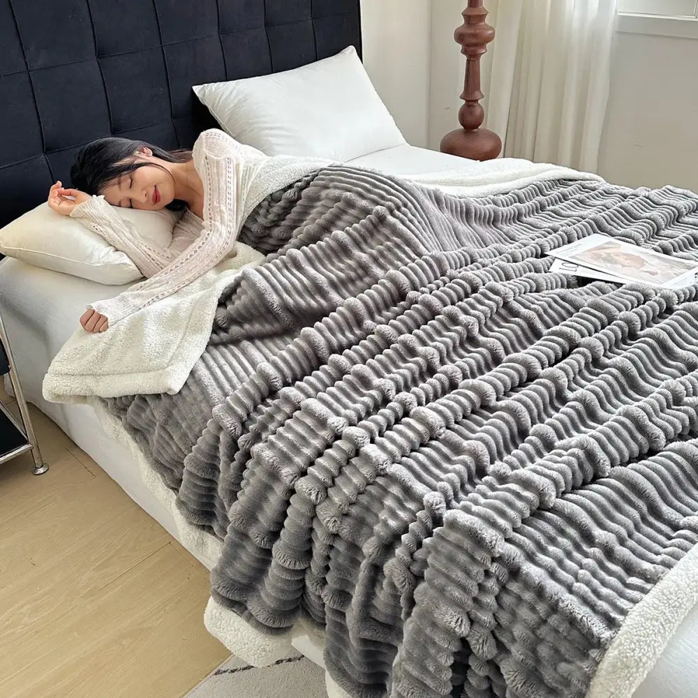 Plush gray and white ribbed sherpa blanket with cozy lamb wool lining by decorbites cozy lamb for bedroom use