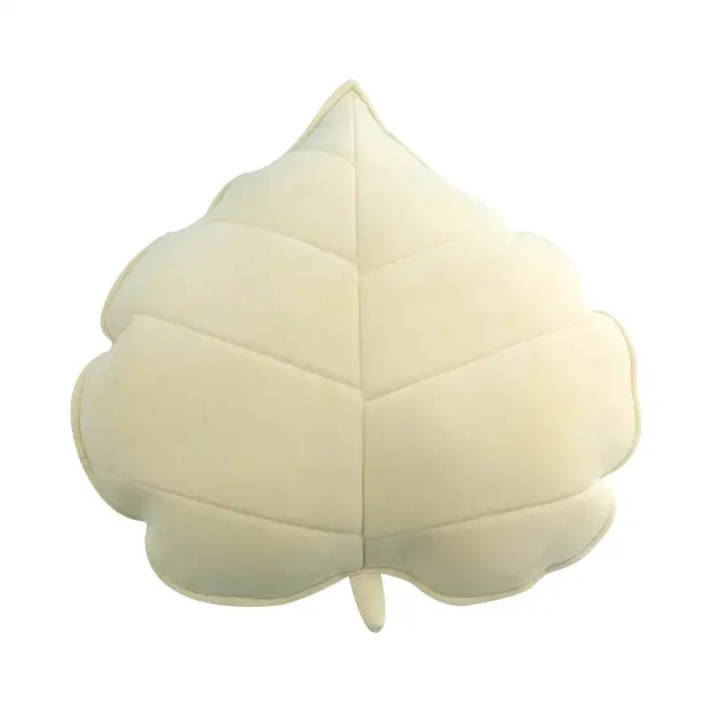 Cream-colored plush leaf shaped throw pillow with stitched veins and velvety texture for living room decorbites 3d leaf decor