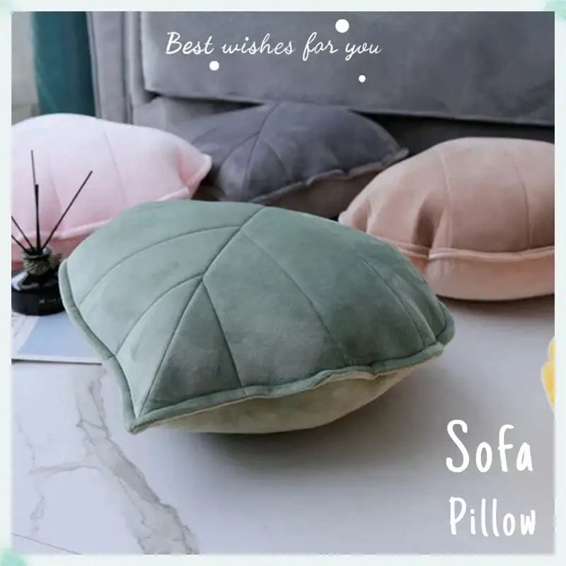 Soft sage green leaf shaped throw pillow with quilted texture and plush velvet finish for decorbites 3d leaf decor