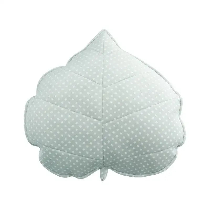 A soft light green leaf shaped throw pillow with white polka dots and stitched edges from decorbites 3d leaf collection