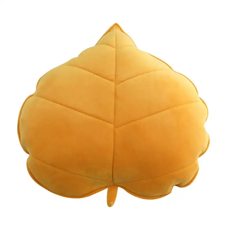 Plush golden-yellow leaf shaped throw pillow with soft velour texture and stitched veins for living room decorbites 3d leaf decor