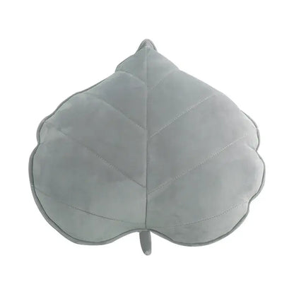 A soft light gray plush leaf shaped throw pillow with stitched veins and stem from decorbites 3d leaf collection for living room decor