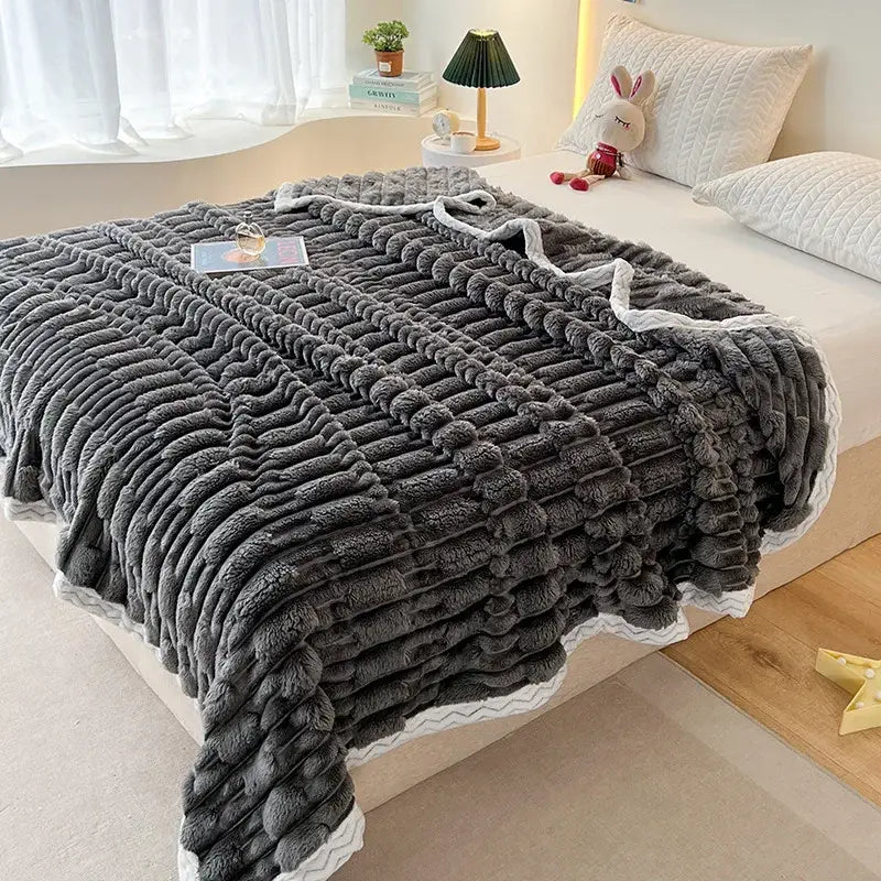 Plush gray bamboo velvet blanket with textured wavy knit pattern and white scalloped edges bedroom throw