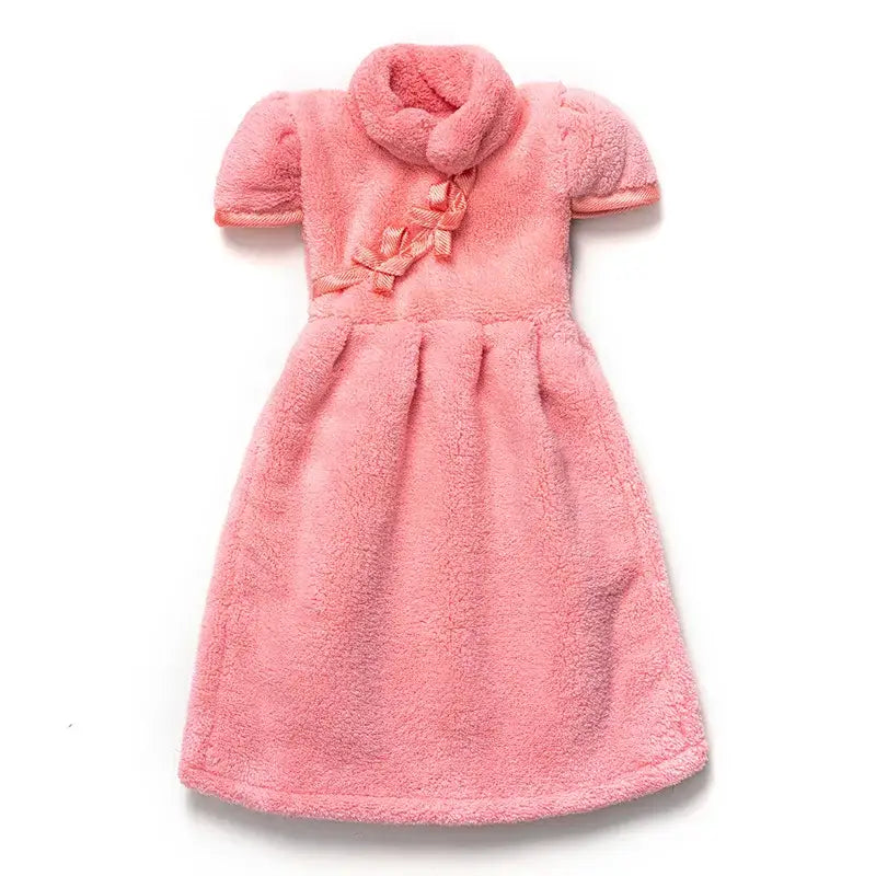 A soft pink plush coral fleece cheongsam hand towel with short puffed sleeves and a matching front-tied cowl neck