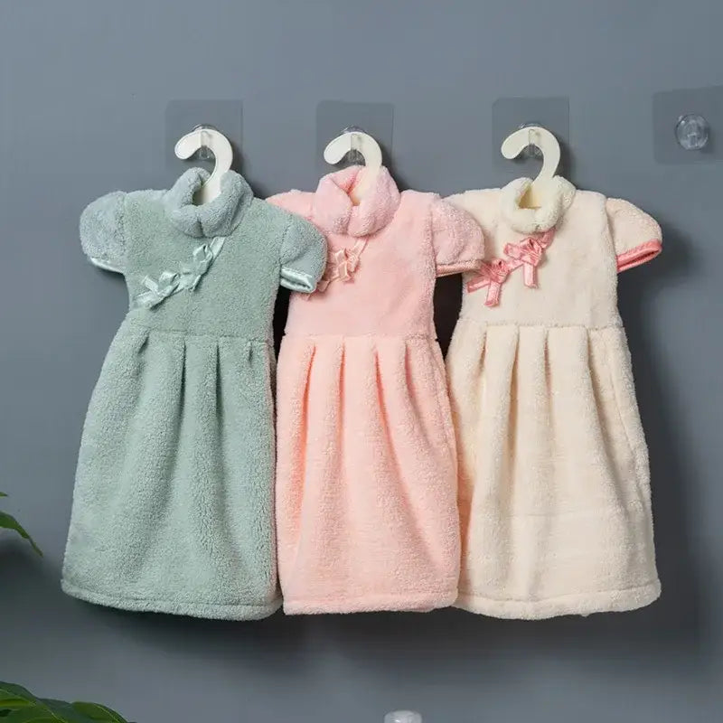 Three pastel green pink and cream plush coral fleece cheongsam hand towels with faux fur collar and decorative bows decorbites