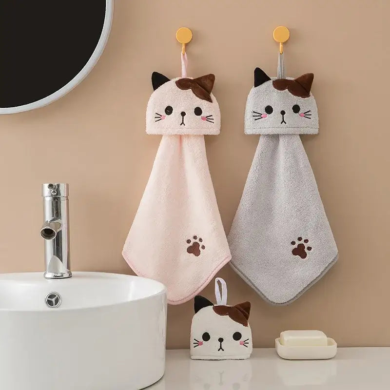 Plush pink and pale yellow cartoon cat hand towel with embroidered faces and paw prints by decorbites cartoon cat for kitchen use