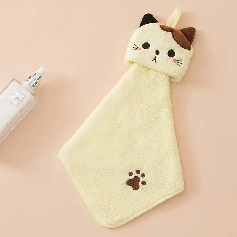 A soft cream-colored plush cartoon cat hand towel with brown embroidered ears and paw print by decorbites cartoon cat