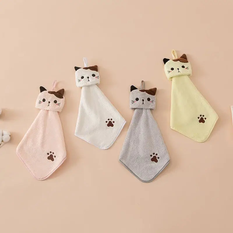 Plush pink and pale yellow cartoon cat hand towels by decorbites featuring embroidered faces and paw prints for kitchen use