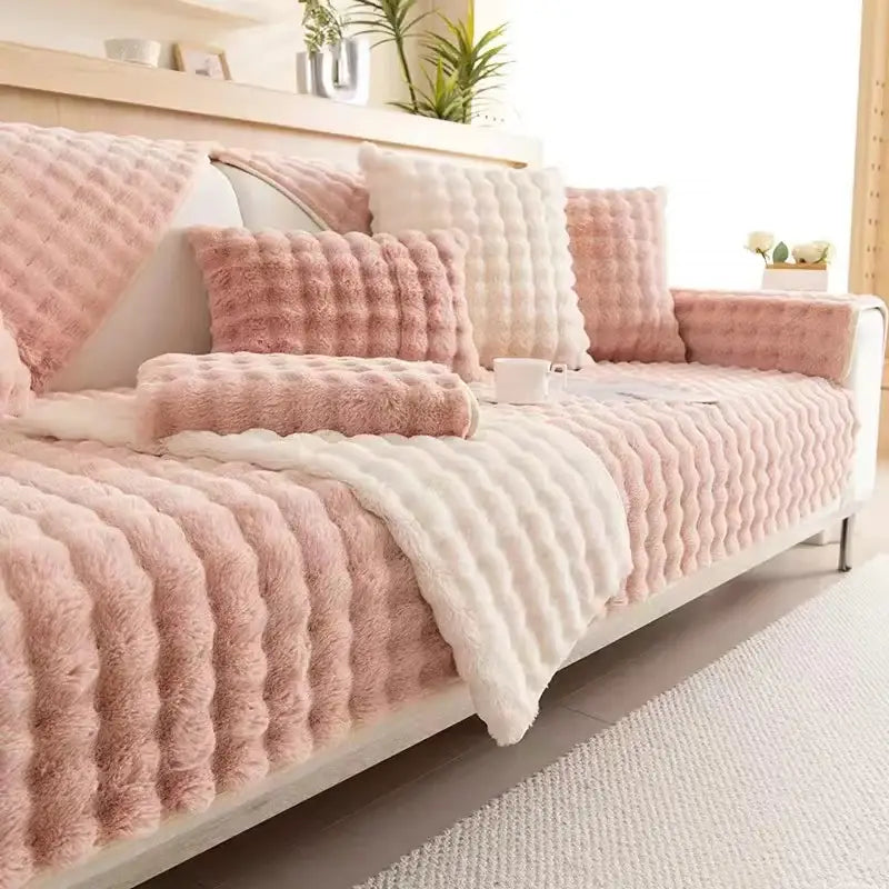 Plush quilted beige and cream sofa slipcover with pink and white textured soft fluffy rabbit fur for living room use
