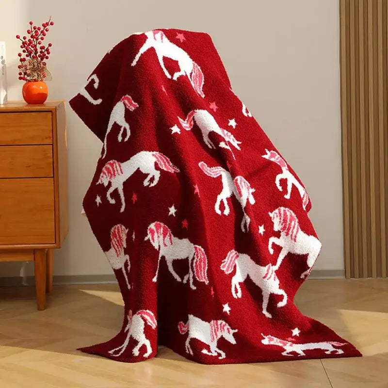Plush red unicorn blanket with white unicorns and stars made of half fleece red perfect for bedroom bedding