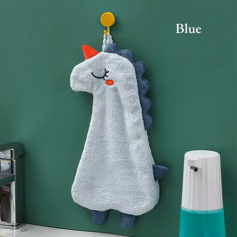 Soft light blue unicorn hand towel with orange horn and double-layer coral velvet featuring dark blue mane and feet