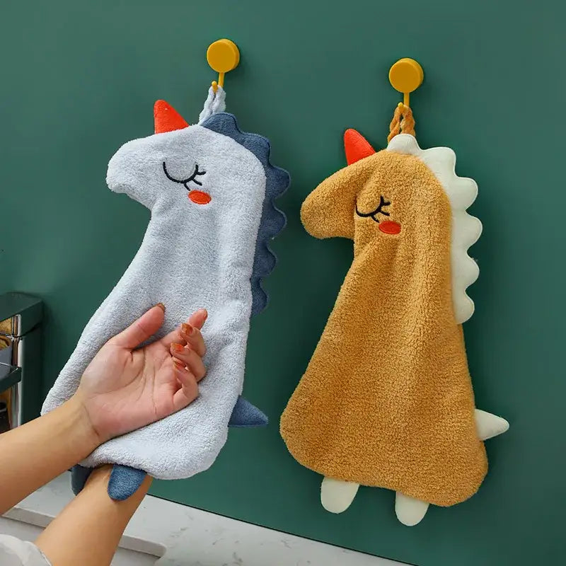Soft plush unicorn shaped hand towel in light blue and tan made of double layer coral velvet for kitchen use