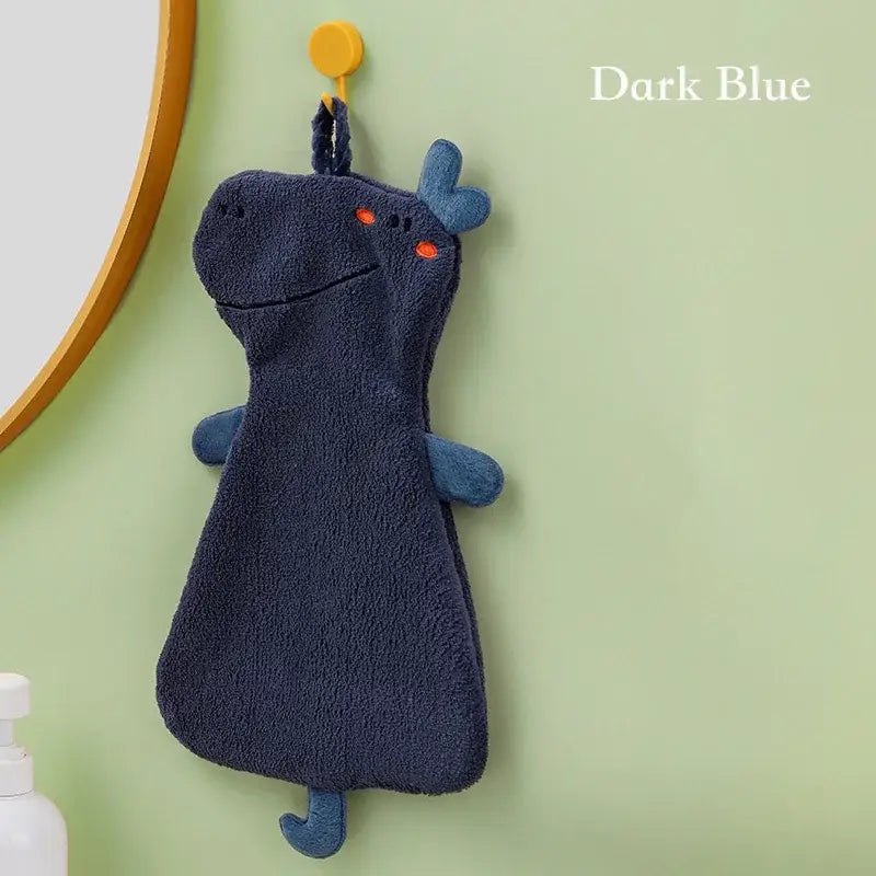 Dark blue plush dinosaur-shaped hand towel with orange embroidered eyes made of double-layer coral velvet for kitchen use
