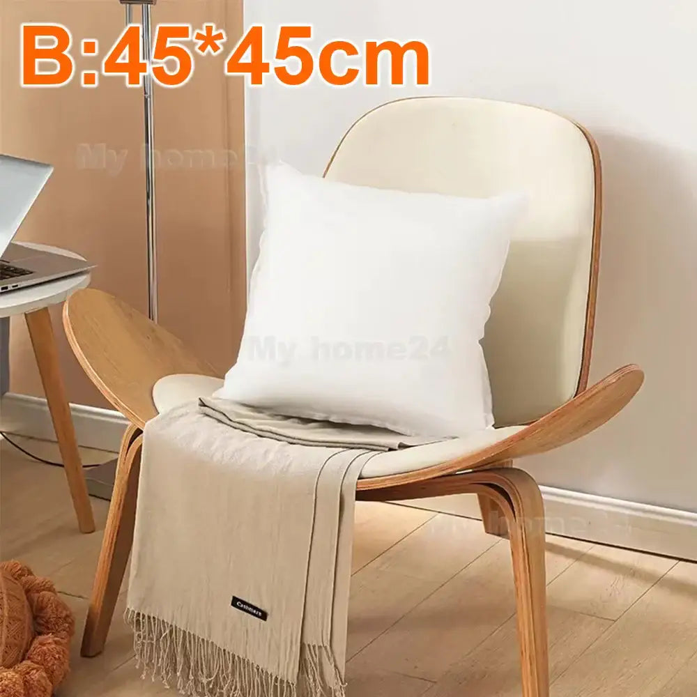 White square decorbites cotton-padded pillow core resting on wooden chair for living room decor