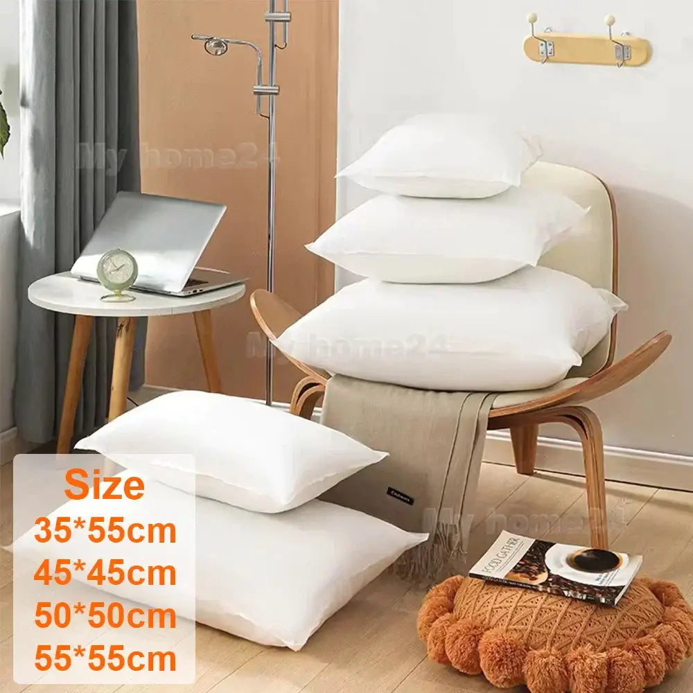 Stack of white plush decorbites cotton-padded pillow core inserts for living room cushion decor