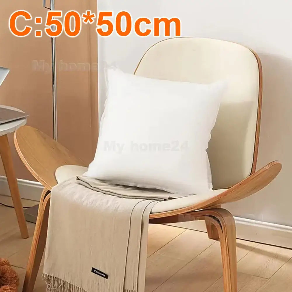 White square decorbites cotton-padded pillow core resting on wooden chair for living room cushion insert