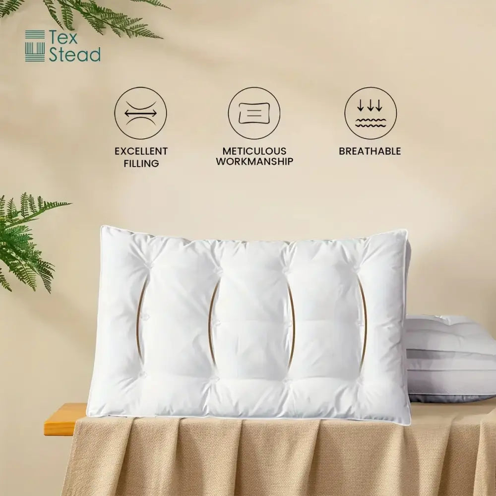Plush white double layer fiber pillow with three vertical stitched sections and subtle gold trim by tex stead