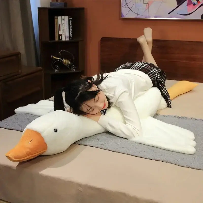 A plush white goose sleep body pillow with an orange beak and soft fabric material ideal for decorbites goose sleep use