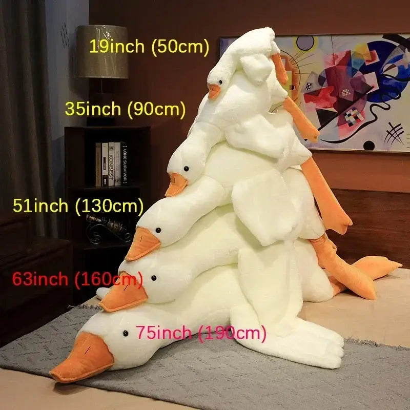 A stack of five plush white goose sleep body pillows with orange beaks and feet in varying sizes for bedroom decorbites goose sleep