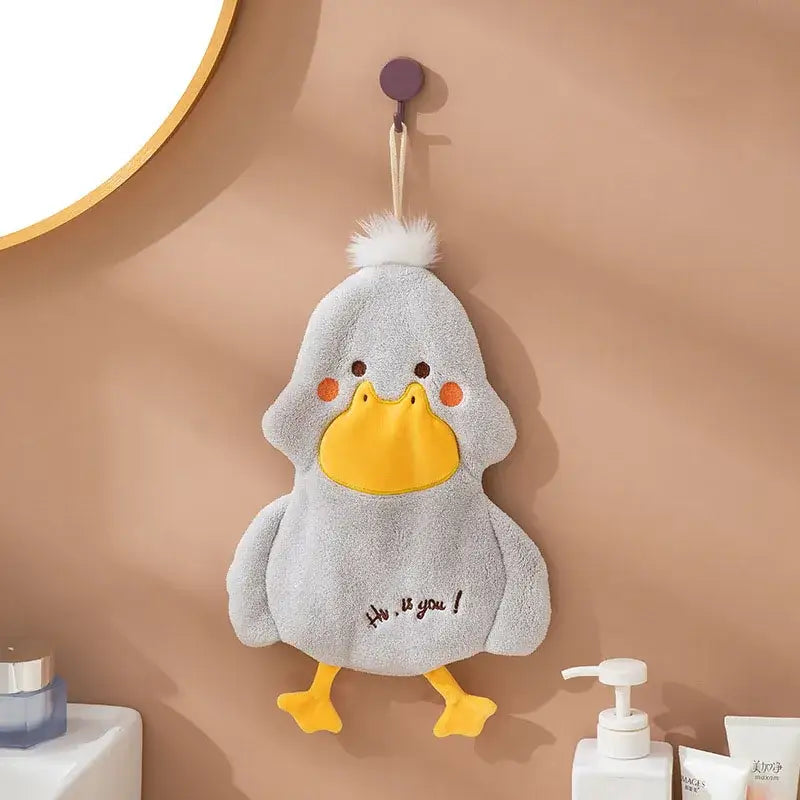 Gray plush duck terry towel with yellow beak feet white pom-pom and embroidered hi is you text for kitchen cleaning