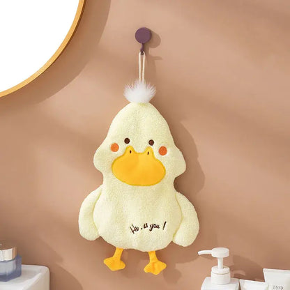A soft pale yellow duck terry towel holder with bright orange beak and feet and a white pom-pom detail