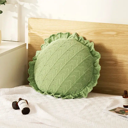 A soft light green knitted pillow with ruffled edge and diagonal pattern for home decor and decorbites 3d flowers pillows